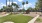 a park with a bench and trees