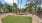a park with a fence and trees